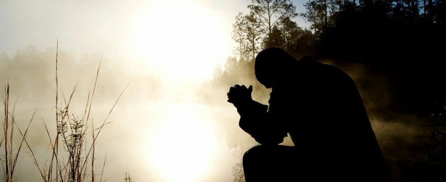 Resist evil praying man outside